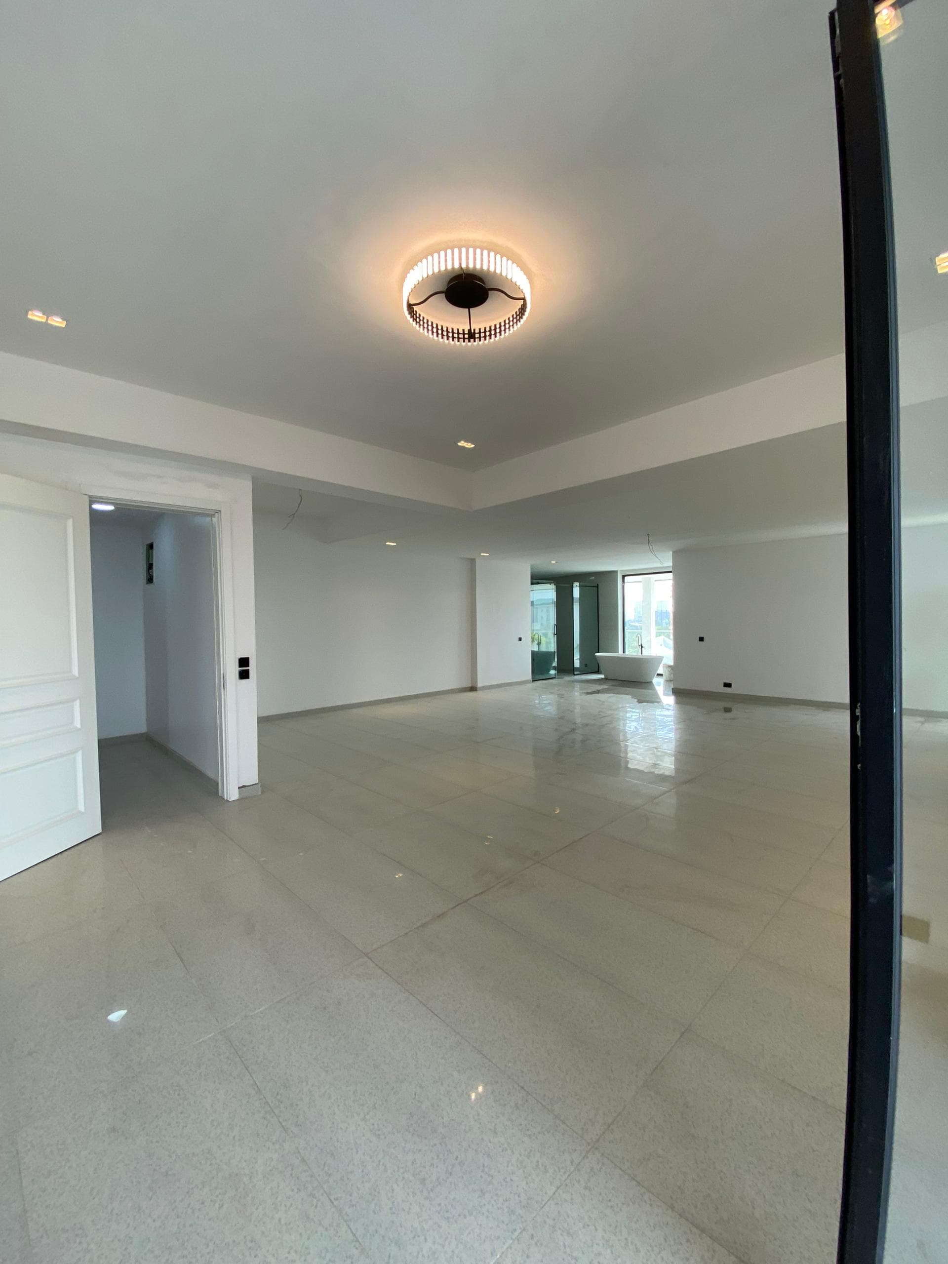 Open-plan interior with polished stone floors